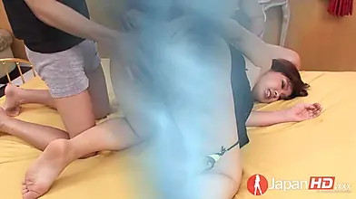 Brunette Japanese beauty enjoys a hardcore threesome with two partners, culminating in a creampie.