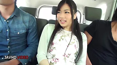 Sultry Japanese Brunette Delights Two Lucky Men with Her Expert Oral Skills