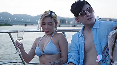 Tattooed Blonde and Chinese Girlfriend Enjoy a Romantic Day Aboard a Boat
